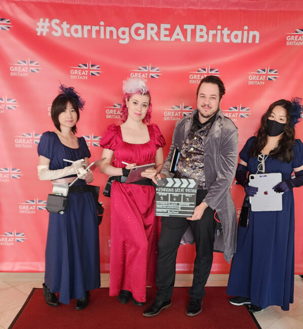 Drawing Booth artists dressed in British TV-themed costumes at live sketch activation for tourism event