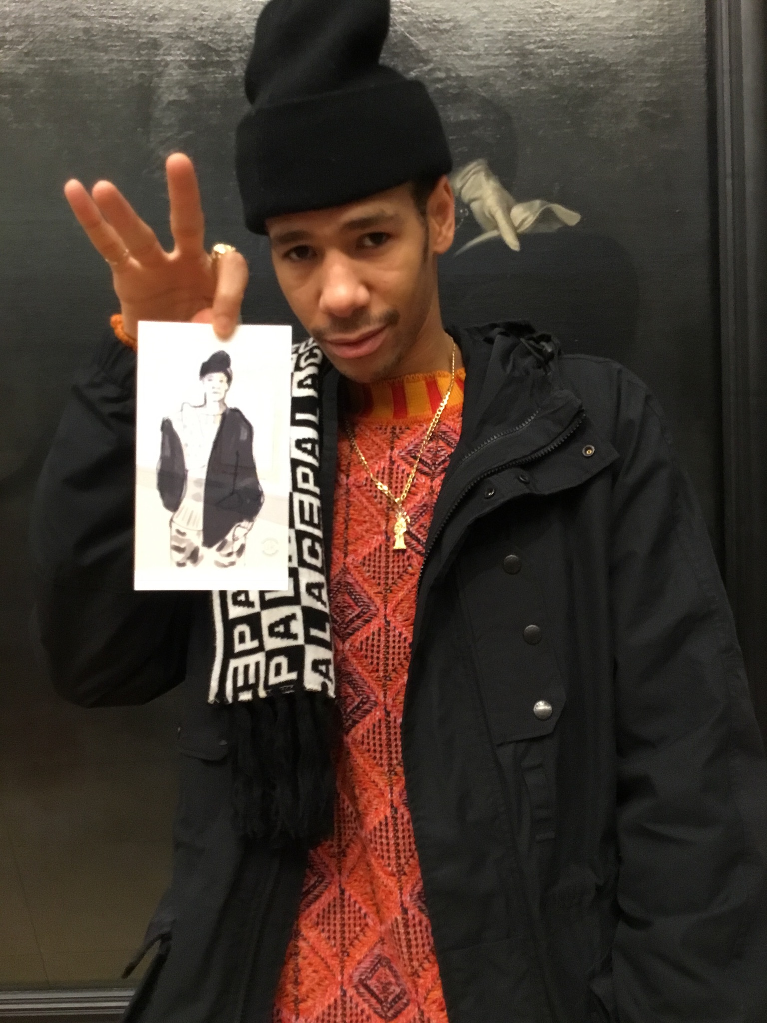 Guest holding fashion sketch drawn by live event fashion illustrator at Tate Britain in London