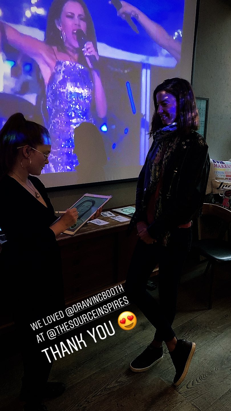 Guest at bar mitzvah holding live sketch created by event sketch artist