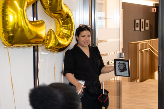 Mobile live event sketch artist creating a digital portrait on an iPad during a corporate event