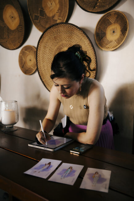 Drawing Booth artist creating digital fashion portraits at the Savage X Fenty summer party in Los Angeles